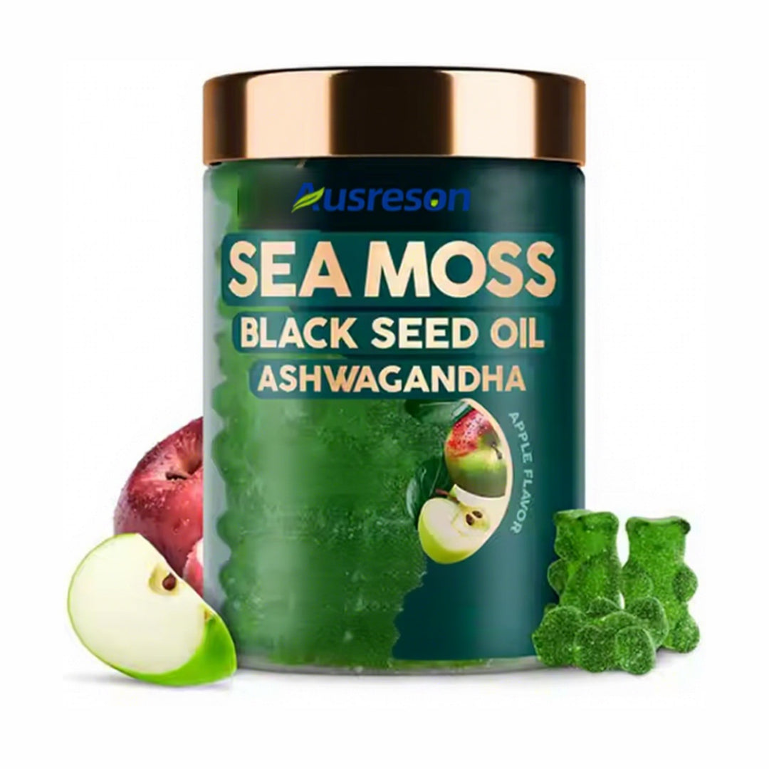 A dark green jar of sea moss, black seed oil, and ashwagandha gummies, apple flavor, shown with apple slices and green gummies on a white background